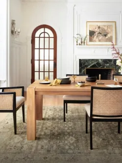 A Persian carpet under a dining table